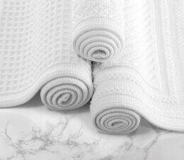 An image of the complete collection of Artesano cotton bath rugs.