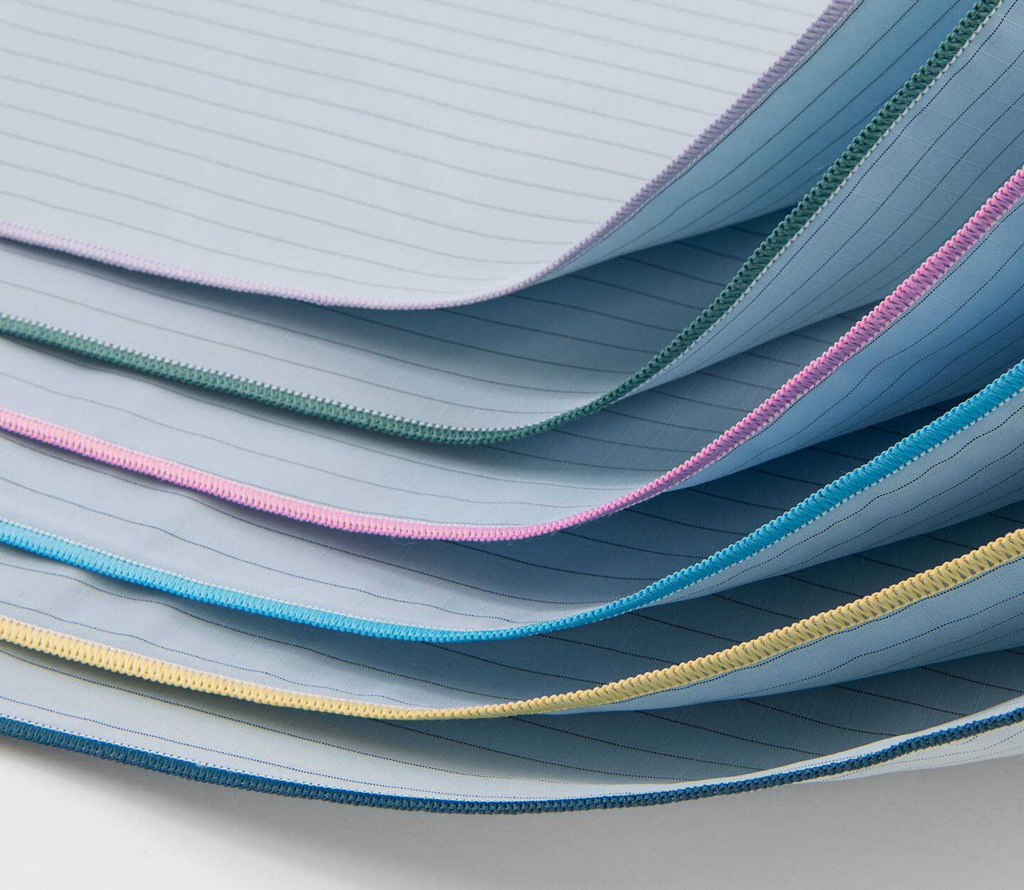 WraPel® SingleWrap® Surgical Wrappers are stacked and folded to show the merrowed edges. These surgical wrappers are dual-ply so you only need one instead of two.