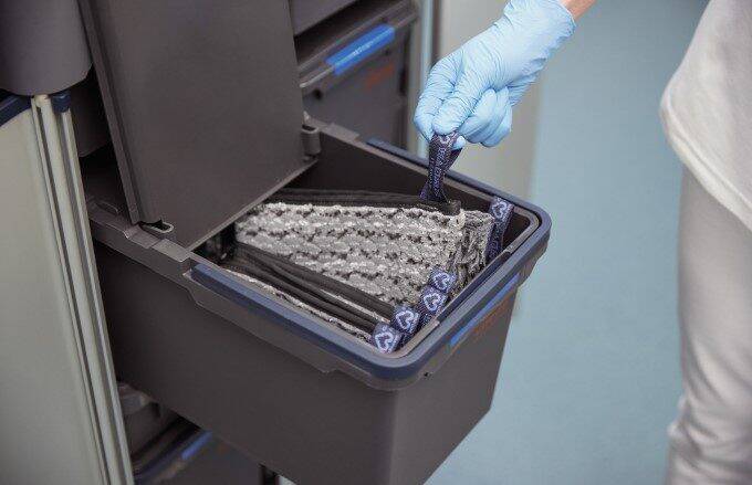 Mop pads in a pre-prepared box filled with cleaning solution.