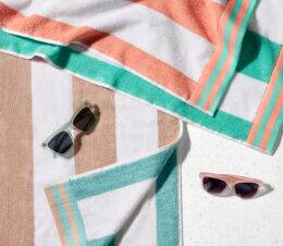 Duet reversible pool towels folded on a table.