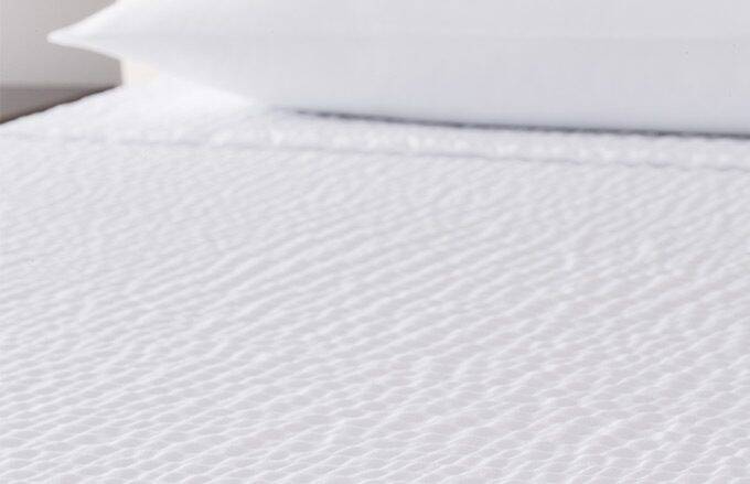 upclose view cumulus top cover on bed with pillow